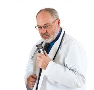Scientist in lab coat talking into recording device