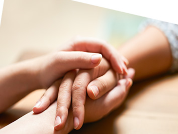 Two people holding hands