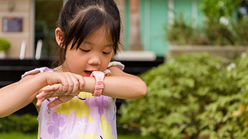 Child interacting with a smart watch