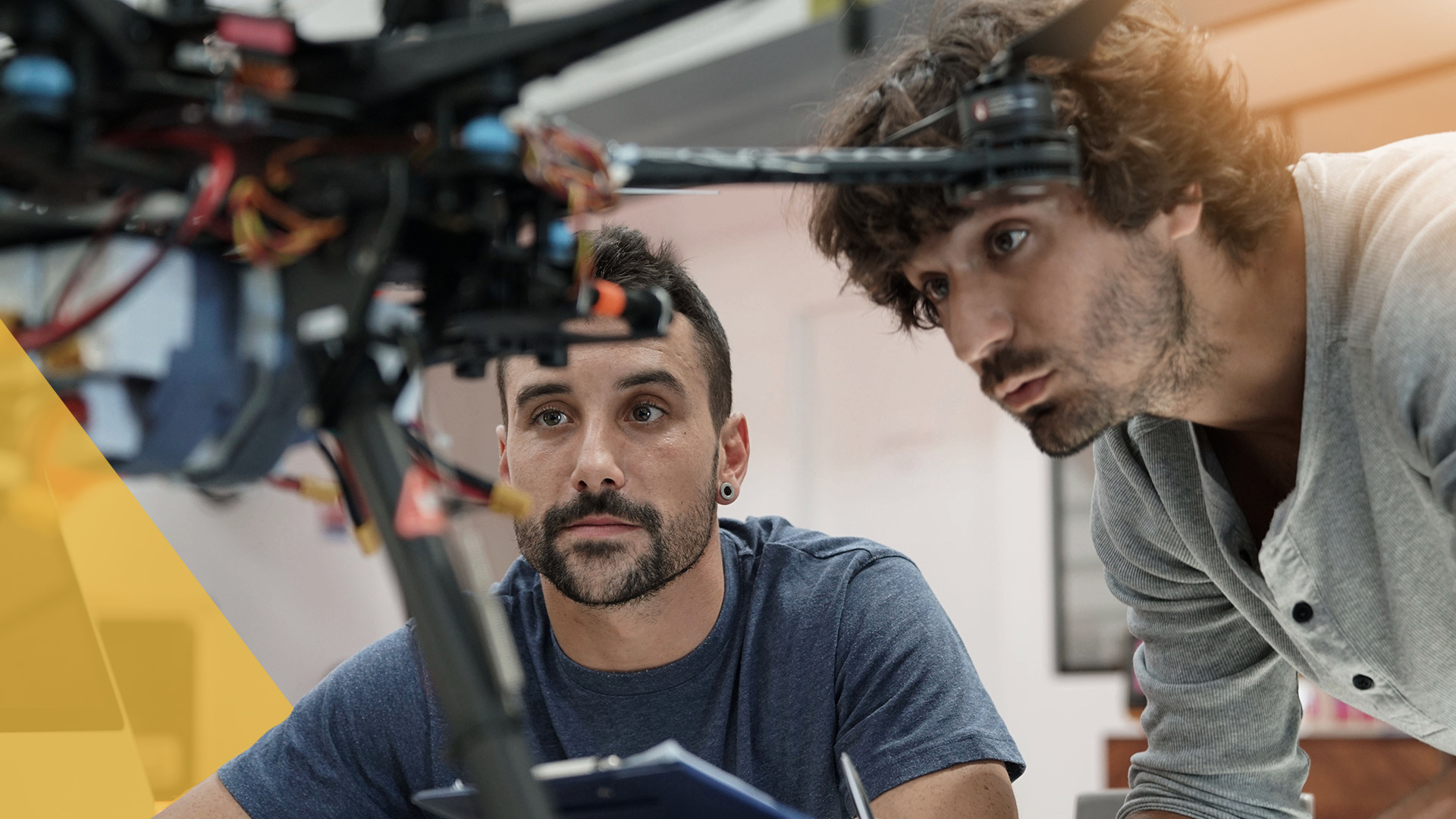 two engineers working on a drone prototype