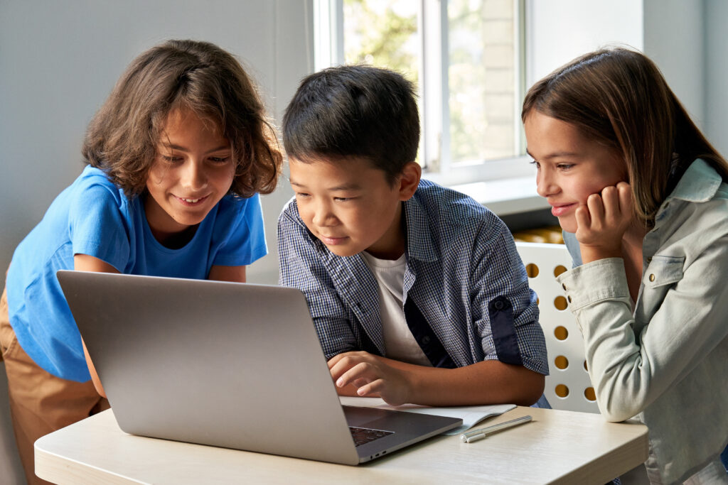 Students work on a computer together