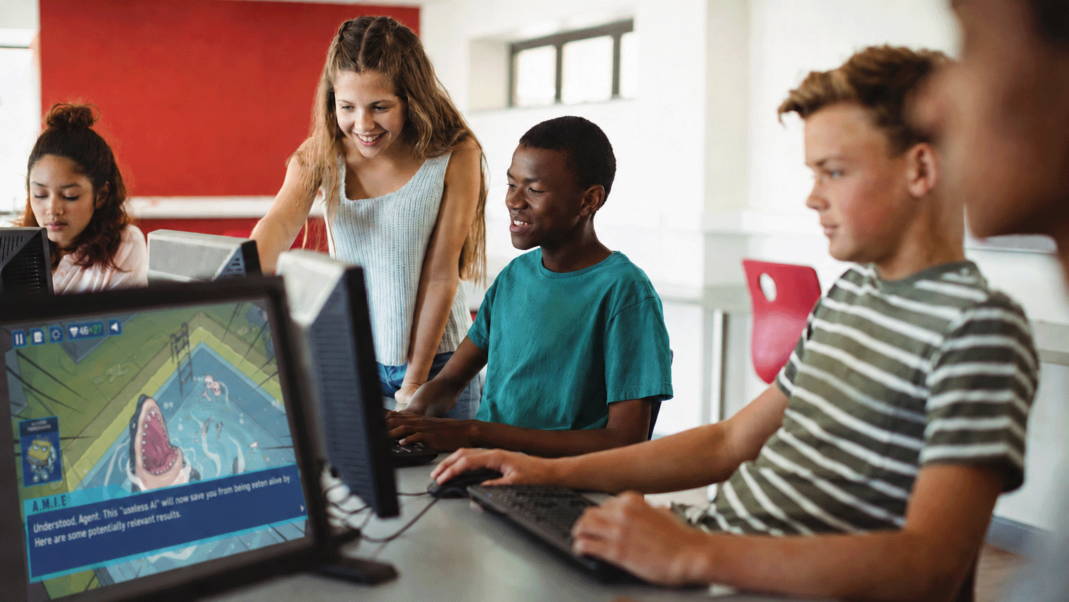 A stock photo rendering of students using the Agents of Influence program running on a school computer.